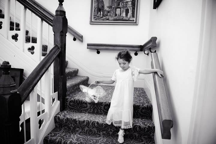 flower girl walking down stairs