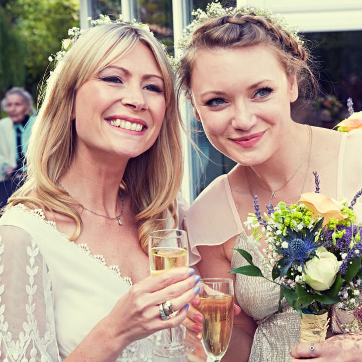 12 70's Wedding with flower crowns and Tipis