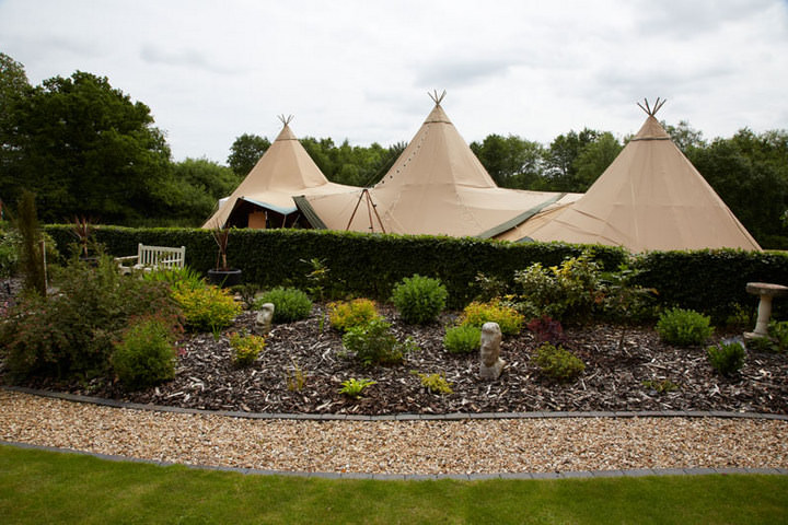 2 70's Wedding with flower crowns and Tipis