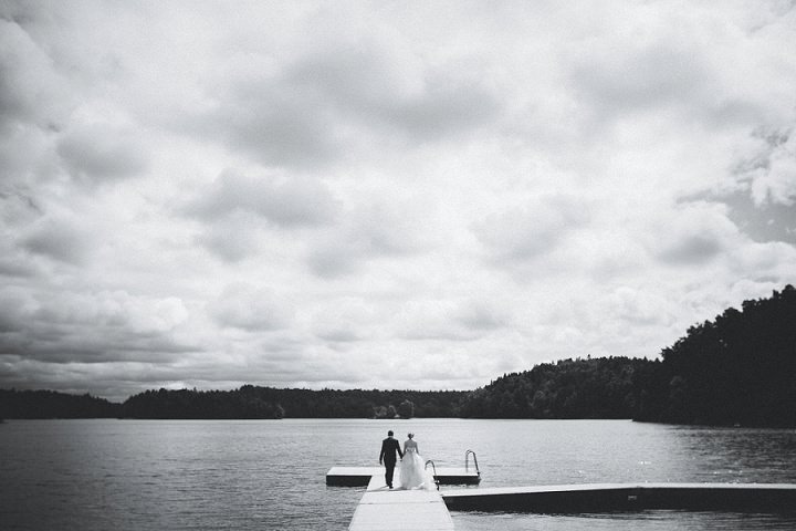 Outdoor Swedish Wedding bride and groom on a pier in Göteborg By Loke Roos Photography