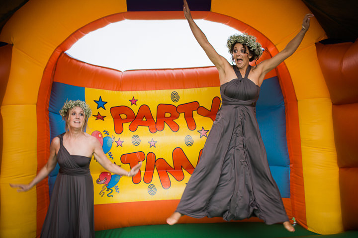 Lisa-Jane and David's Handmade Tipi Wedding bouncy castle with a Bespoke Wedding Dress