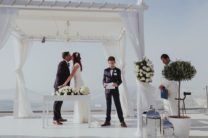 Elegant Santorini Wedding by Steve Fuller Photo, with white roses, an essence of australia gown and a helicopter ride