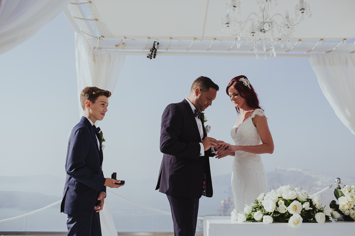 Elegant Santorini Wedding by Steve Fuller Photo, with white roses, an essence of australia gown and a helicopter ride