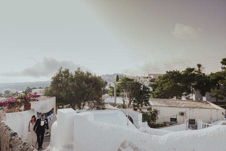 Elegant Santorini Wedding by Steve Fuller Photo, with white roses, an essence of australia gown and a helicopter ride