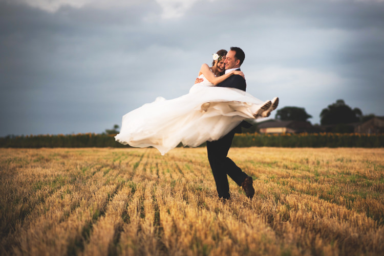 Bohemian, Countryside Wedding in Leicestershire by Martin Makowski. with hay bales and flower crowns.