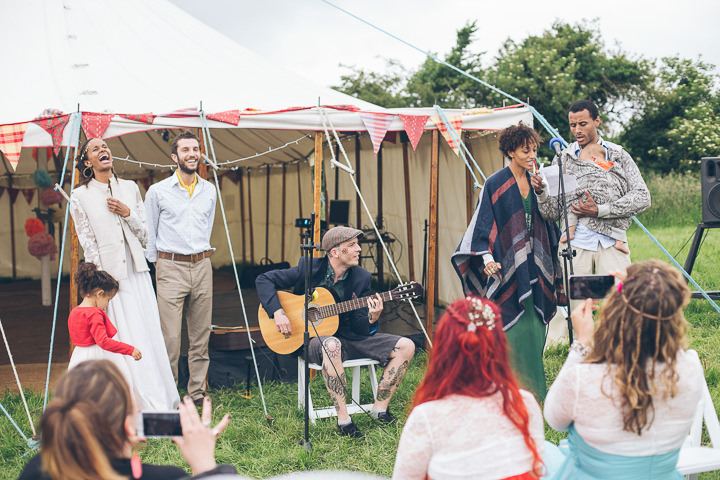 Free Spirited Outdoor Meadow Wedding by Larissa Joice Photography, with flags, wild flowers and a picnic