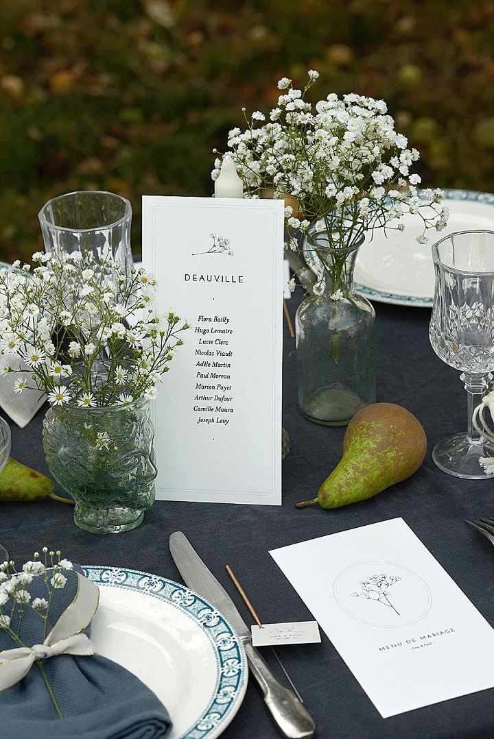 Outdoors scene of a dfecorated wedding table 